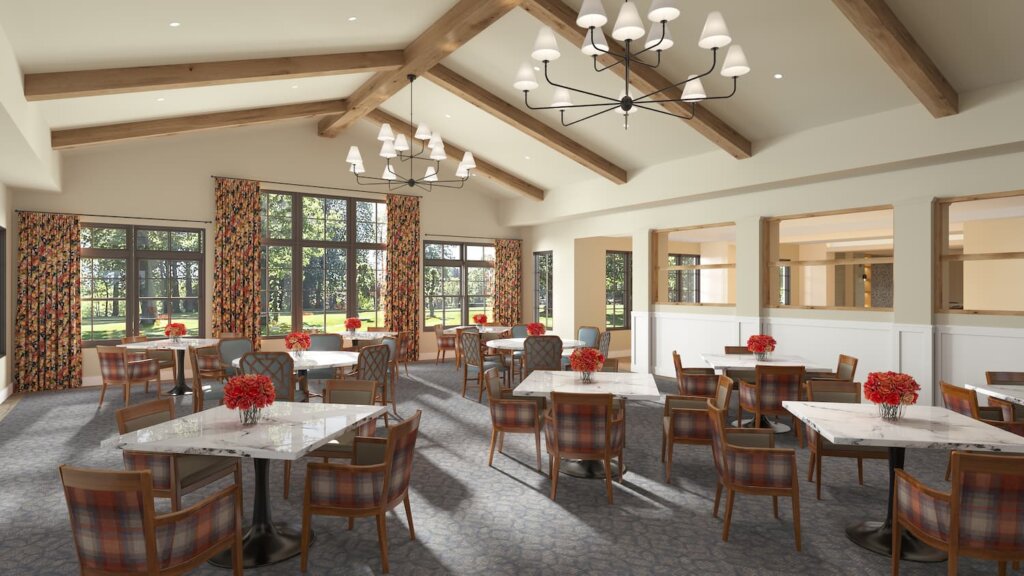 Traditions of Aboite independent living dining room rendering with vaulted wood-beam ceilings, marble-topped tables, plaid upholstered chairs, and floral curtains